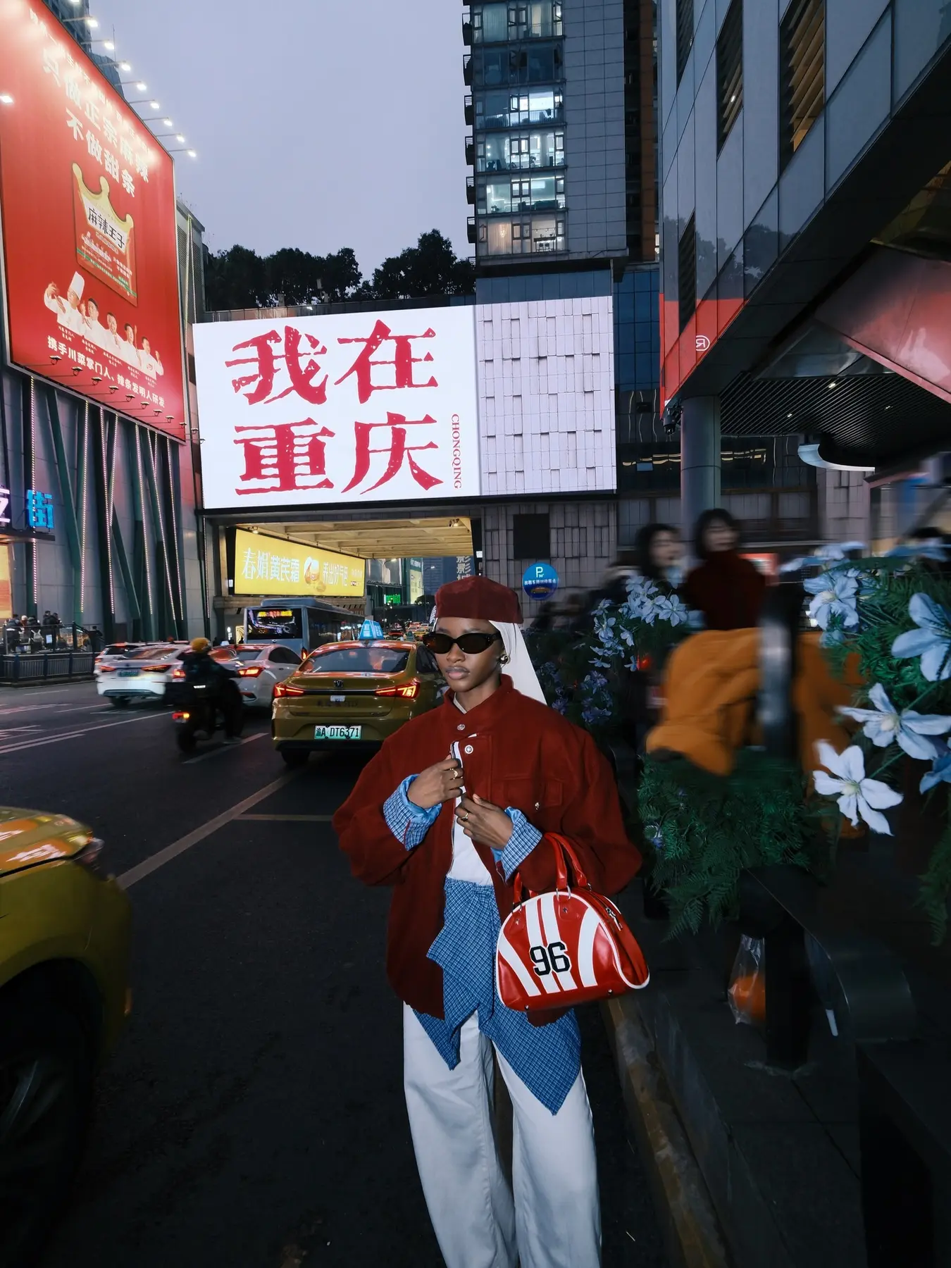 Amina in a confident red look during a Chongqing night outing